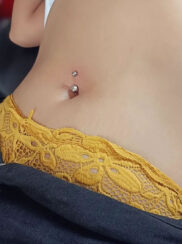 Woman client with her new navel piercing from Irie Pierching Siargao studio.