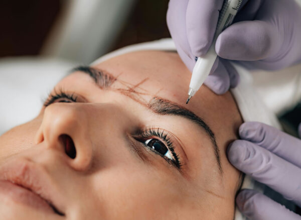 Woman client being prepared for permanent cosmetics procedure.